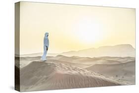 Arab Man Standing in Sand Dunes near Dubai.-David Trood-Stretched Canvas