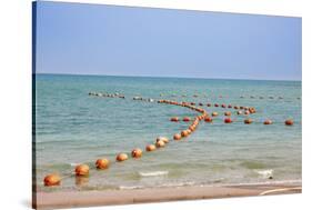 Arabian Peninsula, Persian Gulf, State of Qatar, Doha. Orange buoys in bay.-Emily Wilson-Stretched Canvas