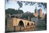 Arch Bridge over a River with a Palace in the Background-null-Mounted Photographic Print