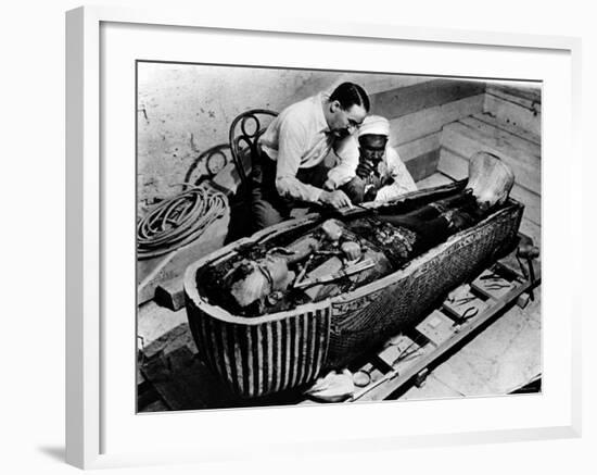 Archaeologist Howard Carter Examining Coffin of Tutankhamen, with 14th Century Egyptian Pharaoh-null-Framed Premium Photographic Print