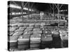 Archie Underwood and Another Man Standing on Top of Great Bales of Cotton in One of His Warehouses-Alfred Eisenstaedt-Stretched Canvas