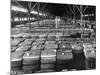 Archie Underwood and Another Man Standing on Top of Great Bales of Cotton in One of His Warehouses-Alfred Eisenstaedt-Mounted Photographic Print