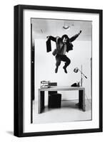 Architect and Designer Frank Gehry Jumping on a Desk in His Line of Cardboard Furniture-Ralph Morse-Framed Photographic Print