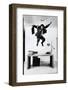 Architect and Designer Frank Gehry Jumping on a Desk in His Line of Cardboard Furniture-Ralph Morse-Framed Photographic Print