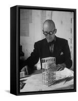Architect Le Corbusier Studying Architectural Plans and Small Model of Building in His Office-Nina Leen-Framed Stretched Canvas