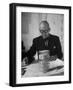 Architect Le Corbusier Studying Architectural Plans and Small Model of Building in His Office-Nina Leen-Framed Premium Photographic Print