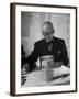 Architect Le Corbusier Studying Architectural Plans and Small Model of Building in His Office-Nina Leen-Framed Premium Photographic Print