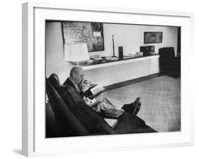 Architect Mies Van Der Rohe Relaxing on Couch While Smoking Cigar and Reading at Home-null-Framed Premium Photographic Print