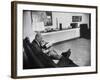 Architect Mies Van Der Rohe Relaxing on Couch While Smoking Cigar and Reading at Home-null-Framed Premium Photographic Print