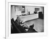 Architect Mies Van Der Rohe Relaxing on Couch While Smoking Cigar and Reading at Home-null-Framed Premium Photographic Print