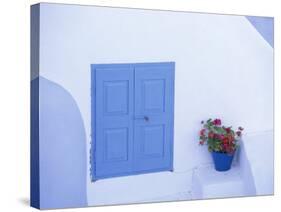 Architectural Detail of Blue and White House, with Pot of Geraniums, Oia (Ia), Aegean Sea, Greece-Sergio Pitamitz-Stretched Canvas