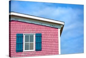 Architecture Detail of a Pink House with Blue Shuttered Window against Blue Sky-pink candy-Stretched Canvas