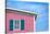 Architecture Detail of a Pink House with Blue Shuttered Window against Blue Sky-pink candy-Stretched Canvas