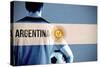 Argentina Football Player Holding Ball against Argentina National Flag-Wavebreak Media Ltd-Stretched Canvas
