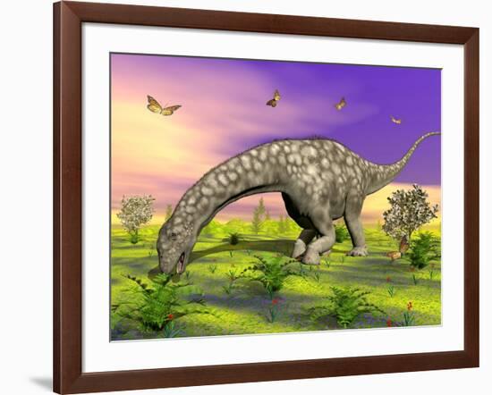 Argentinosaurus Eating Plants While Surrounded by Butterflies and Flowers-null-Framed Art Print