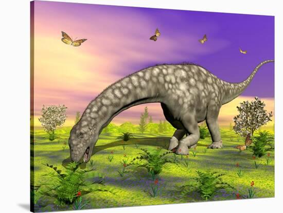 Argentinosaurus Eating Plants While Surrounded by Butterflies and Flowers-null-Stretched Canvas