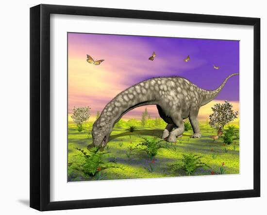 Argentinosaurus Eating Plants While Surrounded by Butterflies and Flowers-null-Framed Art Print