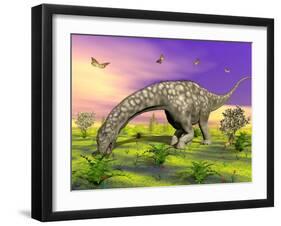 Argentinosaurus Eating Plants While Surrounded by Butterflies and Flowers-null-Framed Art Print