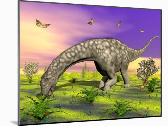 Argentinosaurus Eating Plants While Surrounded by Butterflies and Flowers-null-Mounted Art Print