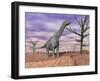 Argentinosaurus Standing on the Cracked Desert Ground Next to Dead Trees-null-Framed Art Print