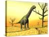 Argentinosaurus Standing on the Cracked Desert Ground Next to Dead Trees-null-Stretched Canvas