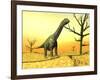 Argentinosaurus Standing on the Cracked Desert Ground Next to Dead Trees-null-Framed Art Print