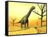 Argentinosaurus Standing on the Cracked Desert Ground Next to Dead Trees-null-Framed Stretched Canvas
