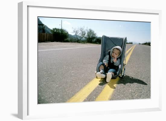 Arizona Junior RAISING ARIZONA by Joel Coen and Ethan Coen, 1987 (photo)-null-Framed Photo