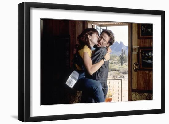 Arizona Junior RAISING ARIZONA by Joel Coen and Ethan Coen with Holly Hunter and Nicolas Cage, 1987-null-Framed Photo