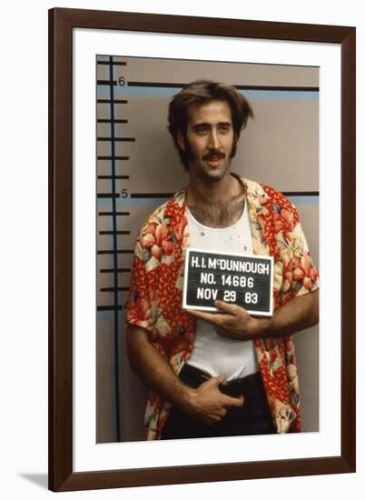 Arizona Junior RAISING ARIZONA by Joel Coen and Ethan Coen with Nicolas Cage, 1987 (photo)-null-Framed Photo