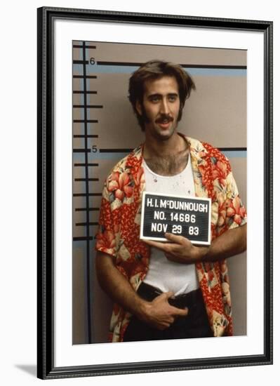 Arizona Junior RAISING ARIZONA by Joel Coen and Ethan Coen with Nicolas Cage, 1987 (photo)-null-Framed Photo