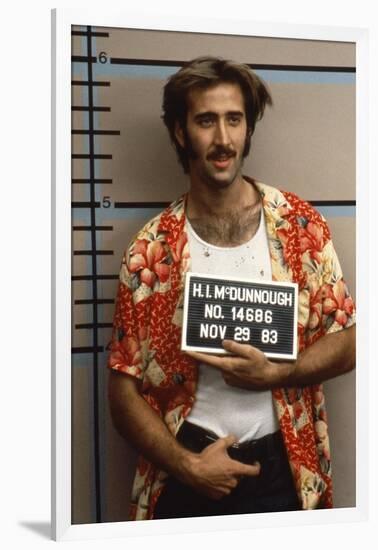 Arizona Junior RAISING ARIZONA by Joel Coen and Ethan Coen with Nicolas Cage, 1987 (photo)-null-Framed Photo