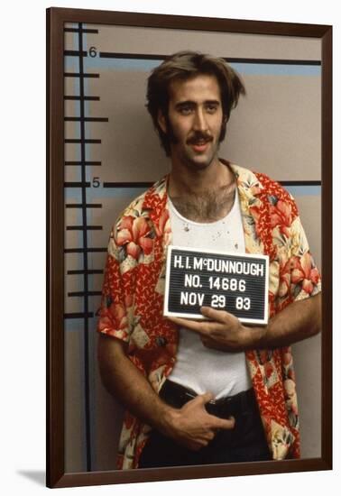 Arizona Junior RAISING ARIZONA by Joel Coen and Ethan Coen with Nicolas Cage, 1987 (photo)-null-Framed Photo