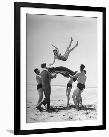 Army Men Bouncing Starlet Majorie Woodworth Into the Air-John Florea-Framed Photographic Print