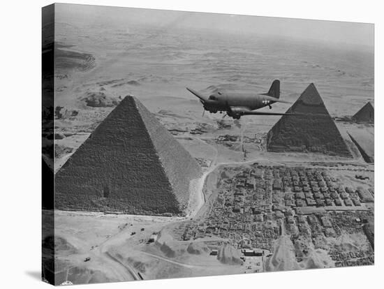 Army Supply Plane over the Pyramids-null-Stretched Canvas