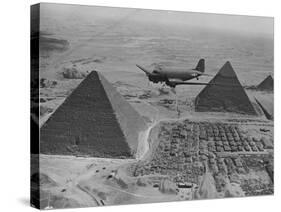 Army Supply Plane over the Pyramids-null-Stretched Canvas