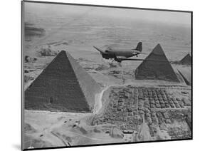 Army Supply Plane over the Pyramids-null-Mounted Photographic Print