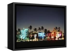 Art Deco Hotels at Dusk, Miami Beach, Florida, USA-Walter Bibikow-Framed Stretched Canvas