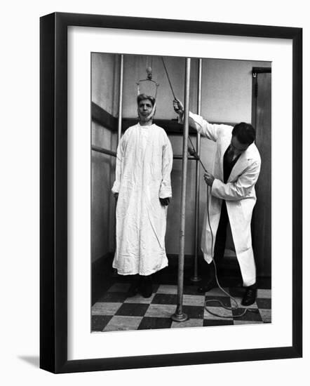 Arthritis Patient Being Treated with Stretching Device at Clinic-Alfred Eisenstaedt-Framed Photographic Print