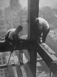 Workers balancing on steel beam above streets during construction of the Manhattan Company Building-Arthur Gerlach-Photographic Print