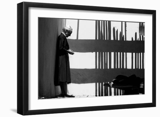 Artist Georgia O'Keeffe Against a Wall Amidst the Shadows of a Fence, Abiquiu, New Mexico, 1966-John Loengard-Framed Photographic Print