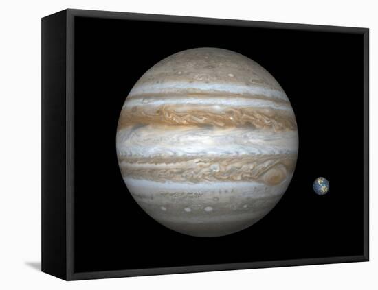 Artist's Concept Comparing the Size of the Gas Giant Jupiter with That of the Earth-Stocktrek Images-Framed Stretched Canvas