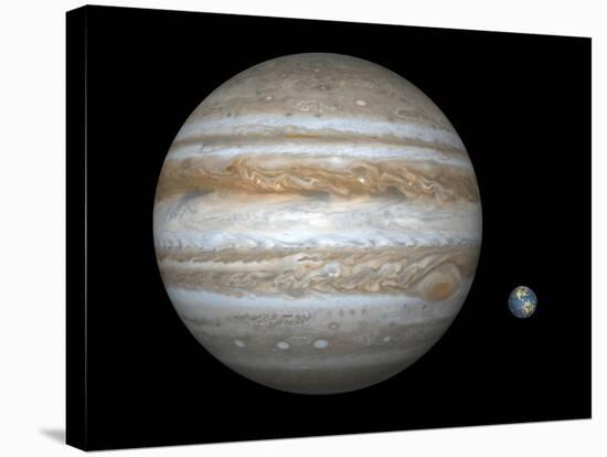 Artist's Concept Comparing the Size of the Gas Giant Jupiter with That of the Earth-Stocktrek Images-Stretched Canvas