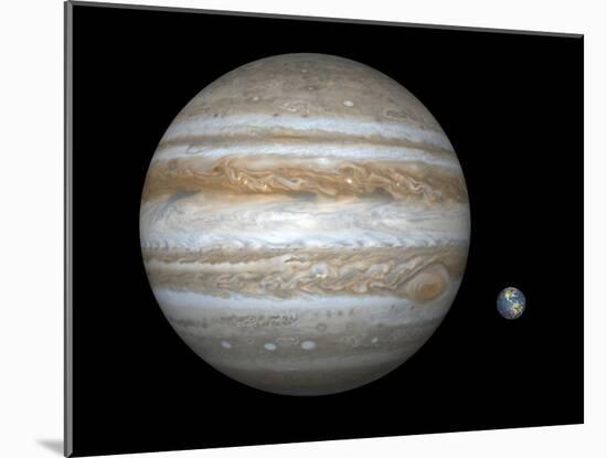 Artist's Concept Comparing the Size of the Gas Giant Jupiter with That of the Earth-Stocktrek Images-Mounted Photographic Print
