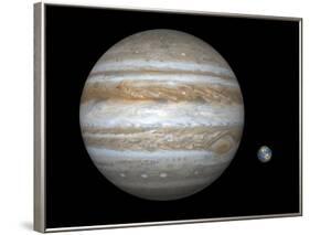 Artist's Concept Comparing the Size of the Gas Giant Jupiter with That of the Earth-Stocktrek Images-Framed Photographic Print