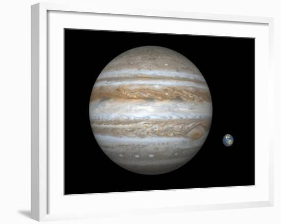 Artist's Concept Comparing the Size of the Gas Giant Jupiter with That of the Earth-Stocktrek Images-Framed Photographic Print