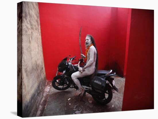 Ash Smeared Naked Hindu Holy Man, Poses on a Motorcycle at the Kumbh Mela Festival in India-null-Stretched Canvas