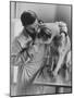 Assistant Caring For a Dog at the Humane Society-Paul Schutzer-Mounted Photographic Print