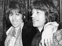 Paul Mccartney and George Harrison Tune their Guitars-Associated Newspapers-Photo