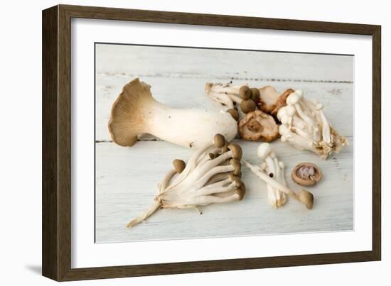 Assorted Edible Mushrooms on a Vintage White Table-Anyka-Framed Photographic Print